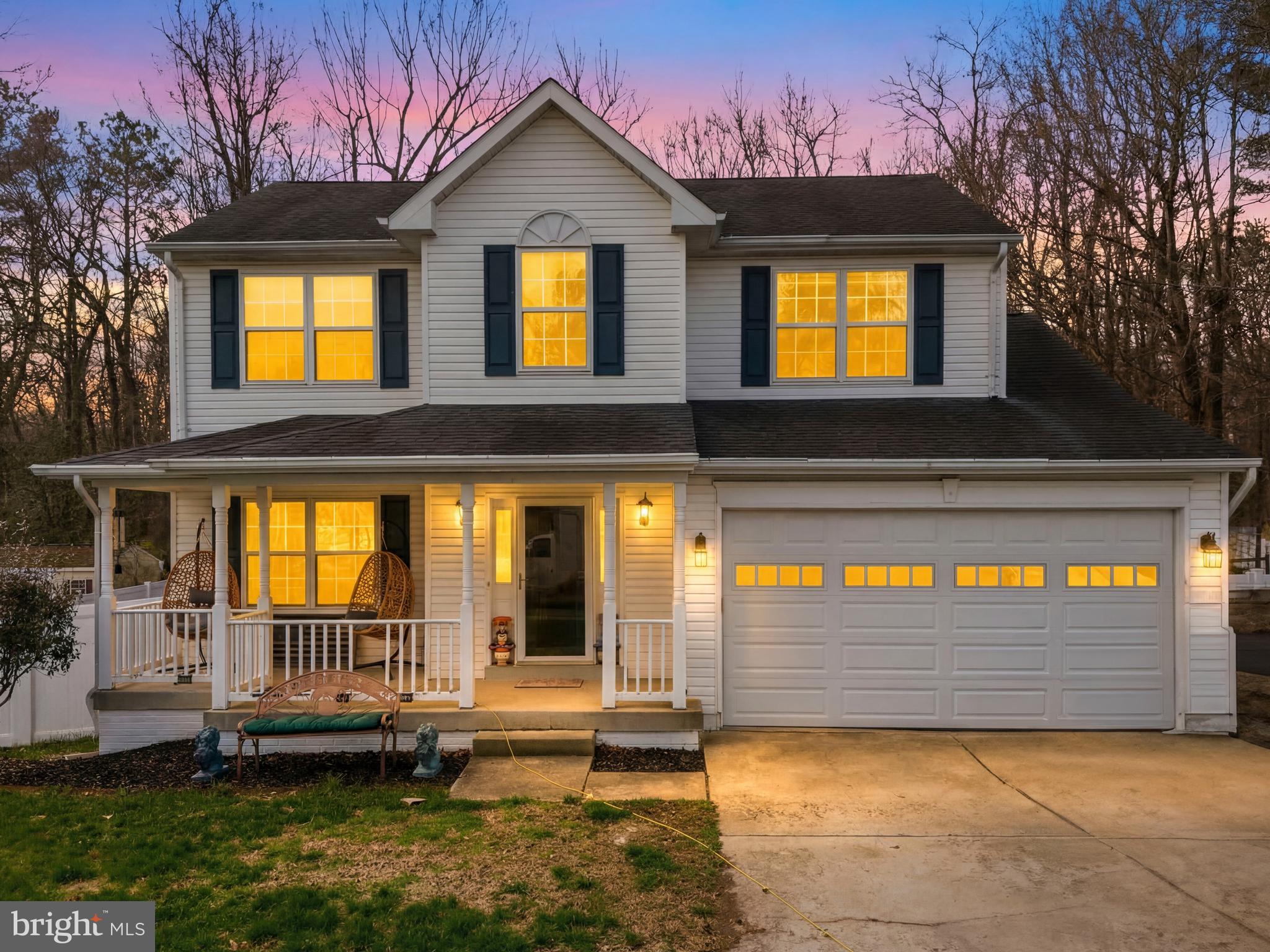 115 Myrtleleaf Circle La Plata, MD 20646 - Photo 2 of 37 a view of a house with a small yard and large windows