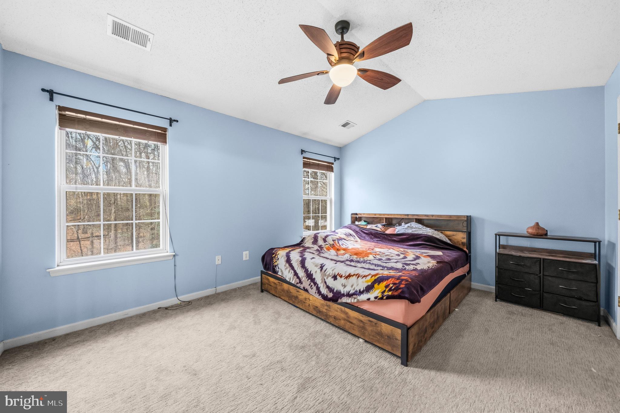 115 Myrtleleaf Circle La Plata, MD 20646 - Photo 23 of 37 a bed sitting in a bedroom next to a window