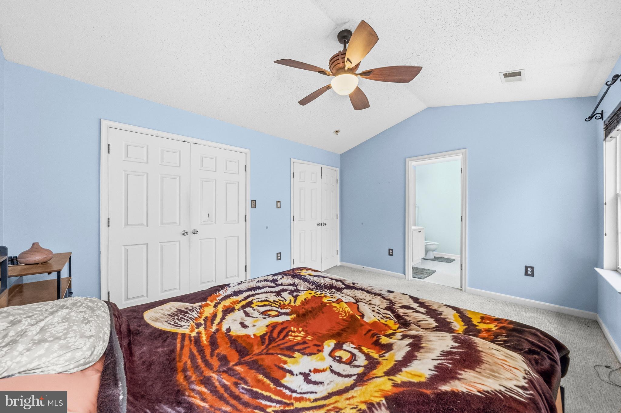 115 Myrtleleaf Circle La Plata, MD 20646 - Photo 24 of 37 a bedroom with a bed and a chandelier