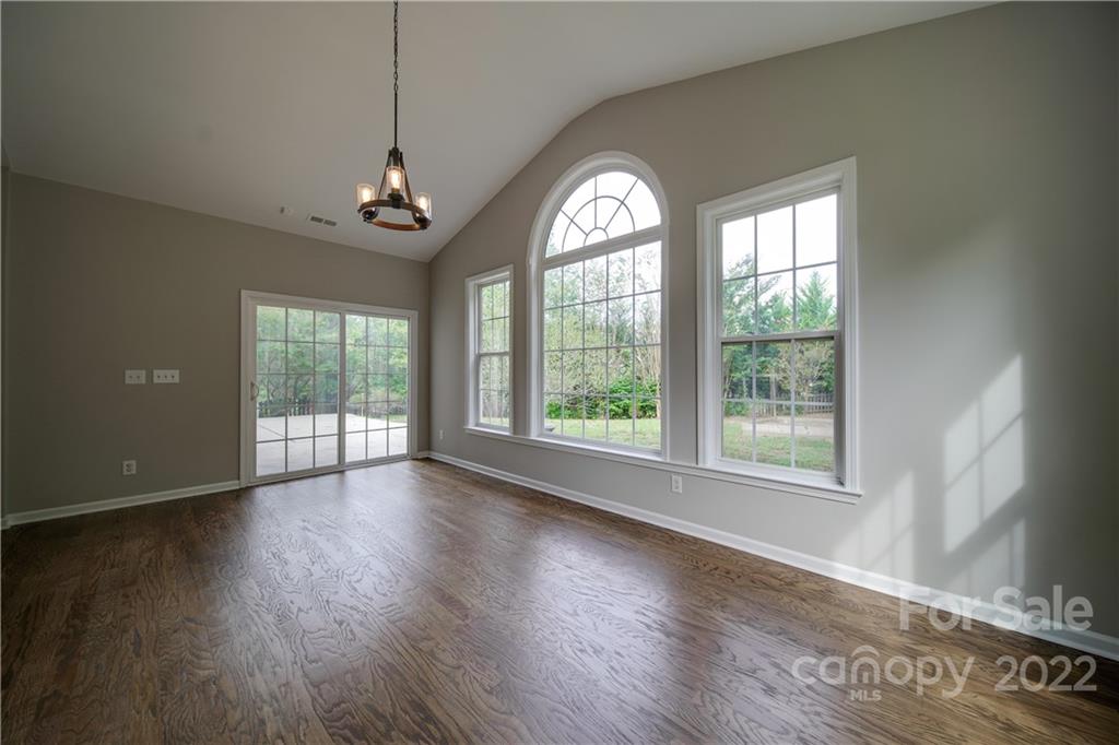 2751 Rivendale Court Indian Land, SC 29707 - Photo 23 of 48 a view of an empty room with wooden floor and a window