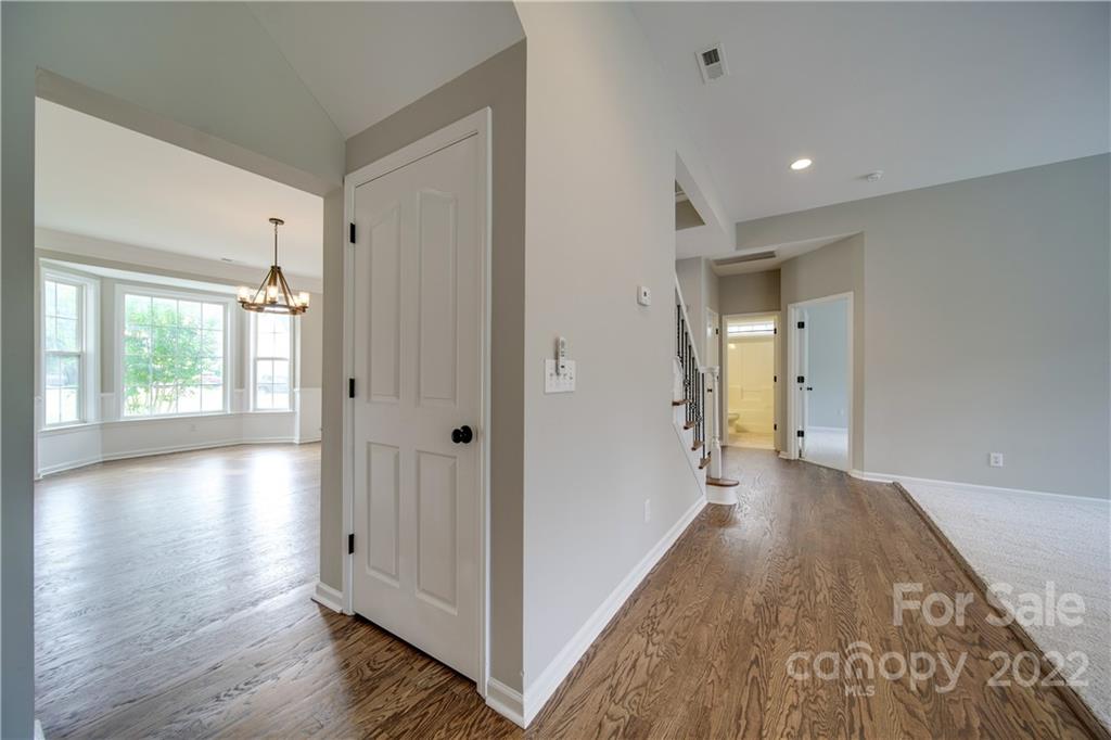 2751 Rivendale Court Indian Land, SC 29707 - Photo 25 of 48 a view of a hallway with wooden floor and windows