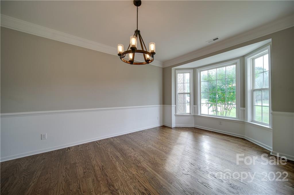 2751 Rivendale Court Indian Land, SC 29707 - Photo 27 of 48 a view of an empty room with wooden floor and a window