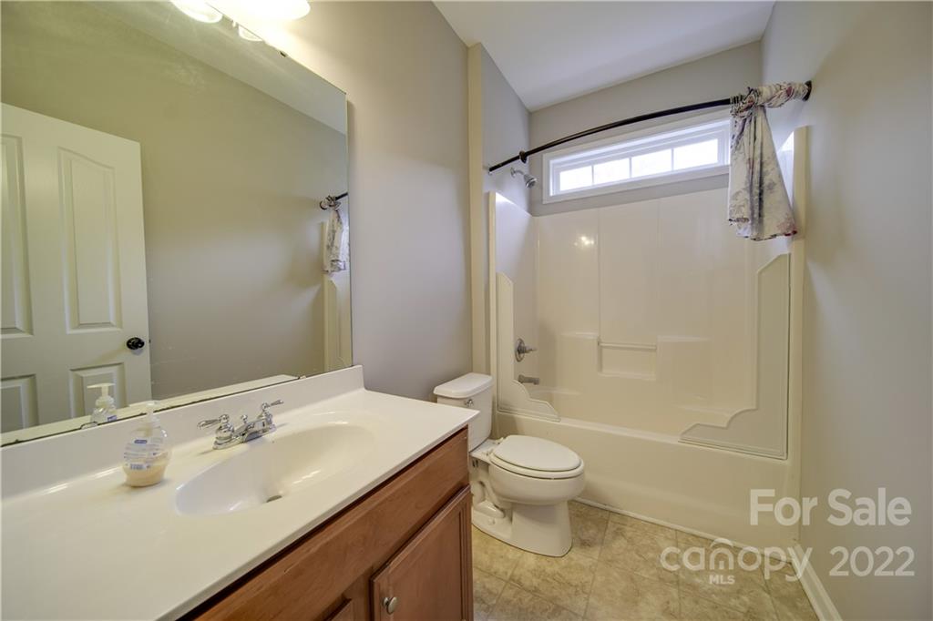 2751 Rivendale Court Indian Land, SC 29707 - Photo 31 of 48 a bathroom with a sink a toilet and shower
