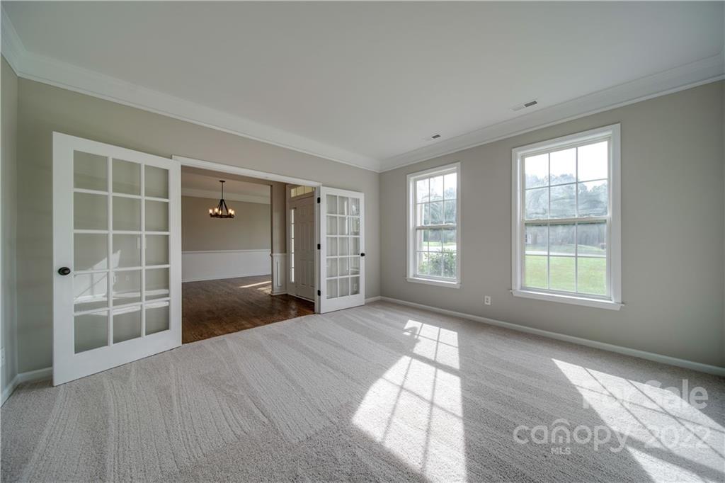 2751 Rivendale Court Indian Land, SC 29707 - Photo 4 of 48 a view of an empty room with a window and wooden floor