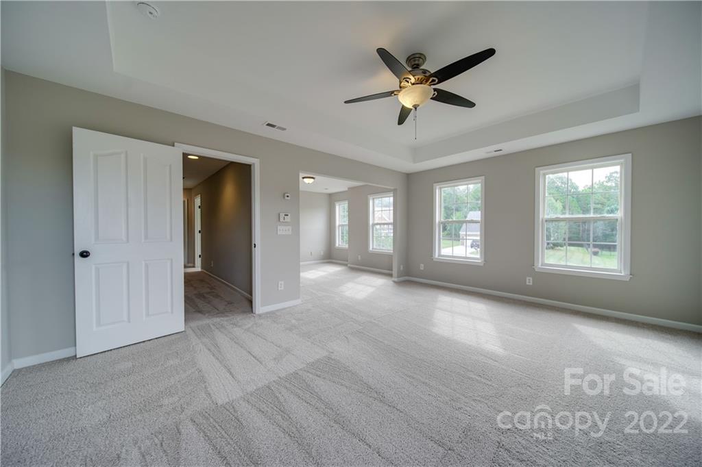 2751 Rivendale Court Indian Land, SC 29707 - Photo 44 of 48 a view of a livingroom with a ceiling fan and window