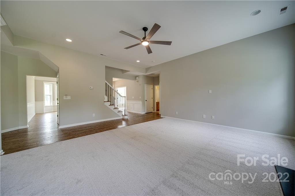 2751 Rivendale Court Indian Land, SC 29707 - Photo 8 of 48 an empty room with wooden floor fan and windows