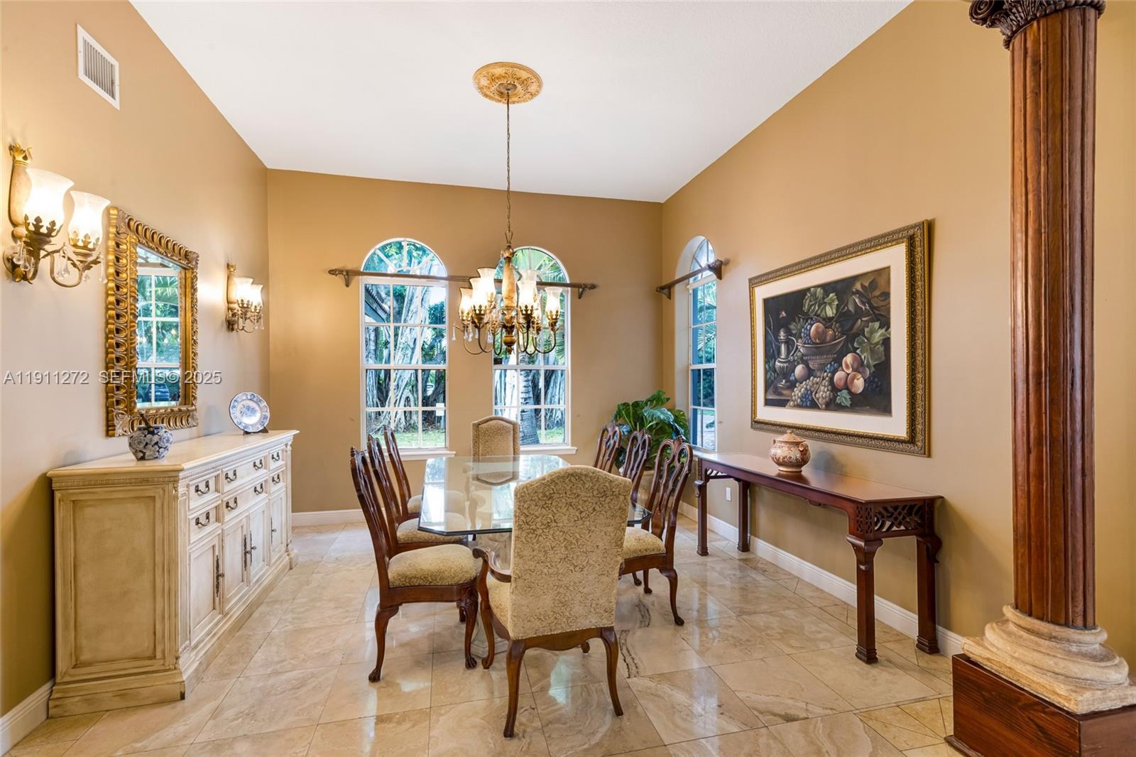 7250 Southwest 99th Street Pinecrest, FL 33156 - Photo 12 of 40 a view of a dining room with furniture window and wooden floor