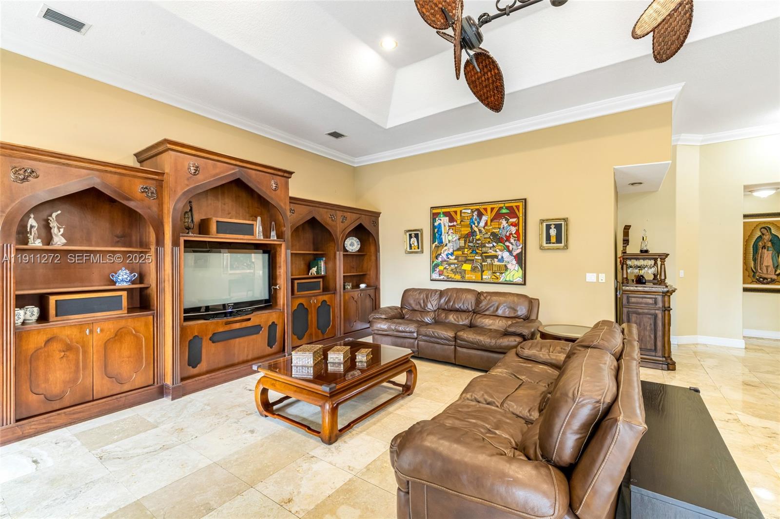 7250 Southwest 99th Street Pinecrest, FL 33156 - Photo 19 of 40 a living room with furniture gym equipment and stainless steel appliances