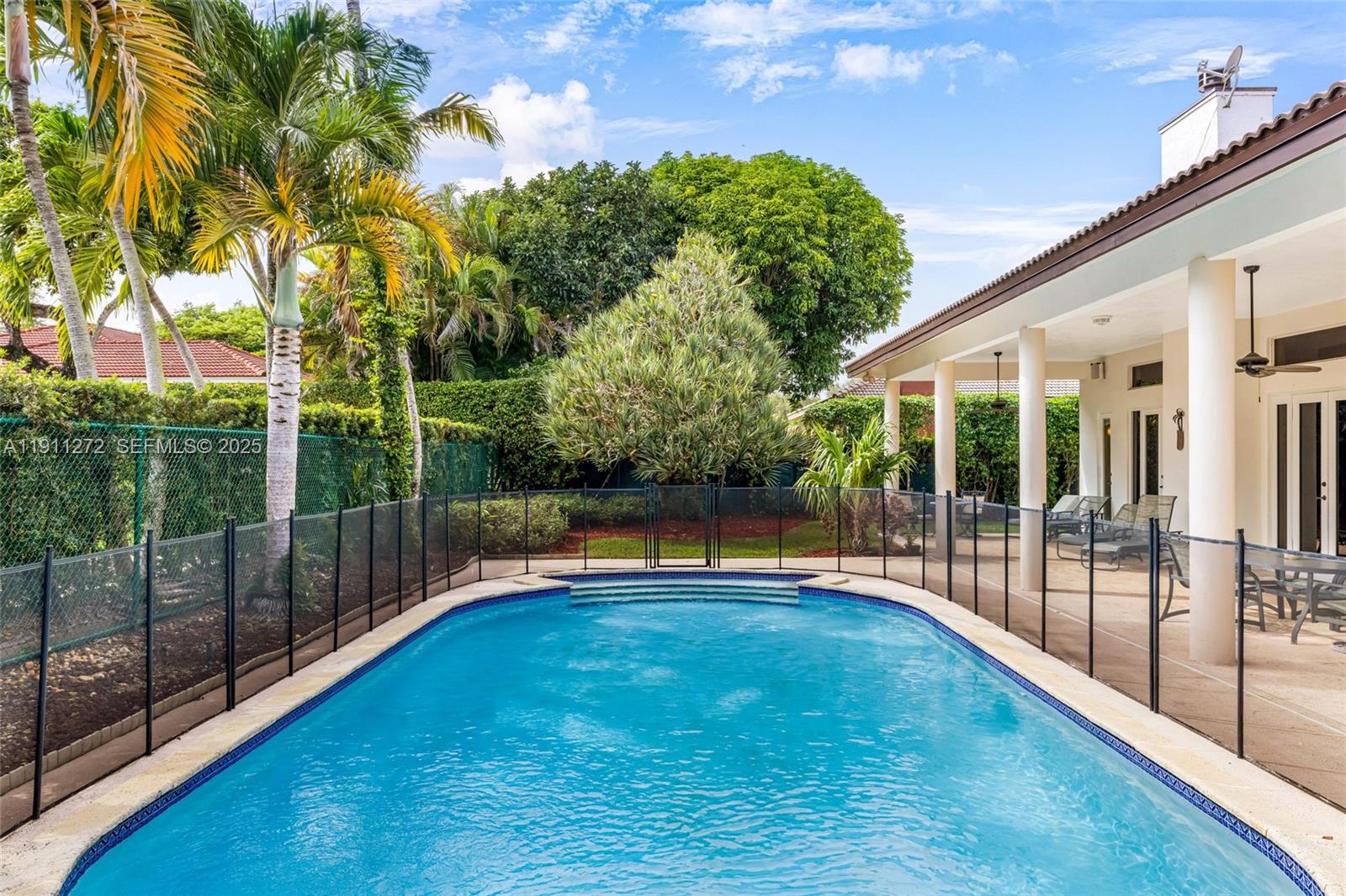 7250 Southwest 99th Street Pinecrest, FL 33156 - Photo 27 of 40 a view of outdoor space yard and swimming pool