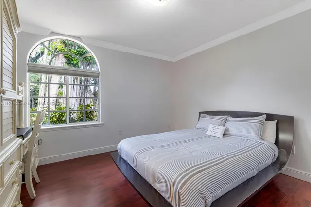 a spacious bathroom with a double vanity sink a mirror and shower