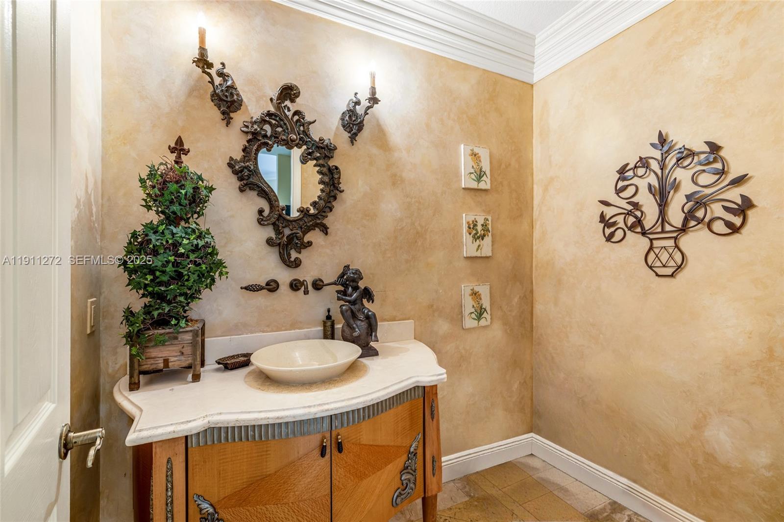 7250 Southwest 99th Street Pinecrest, FL 33156 - Photo 36 of 40 a bathroom with a sink mirror and vanity