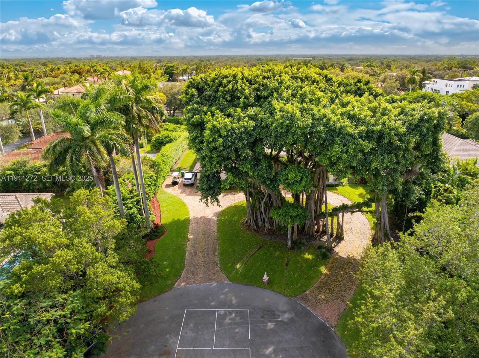 7250 Southwest 99th Street Pinecrest, FL 33156 - Photo 40 of 40 a view of a yard with an outdoor space