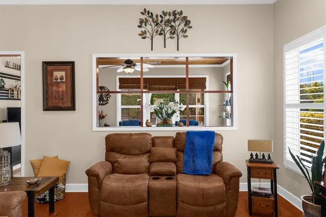 a view of a livingroom with furniture and a window