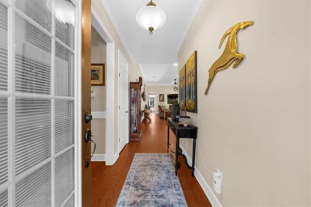 a kitchen with a refrigerator a sink dishwasher stove and oven with wooden floor