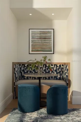 a room with a fireplace and cabinet