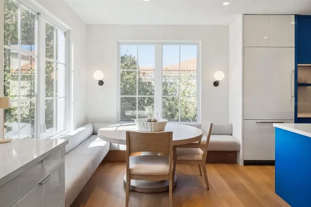 a dining room with a window and a table