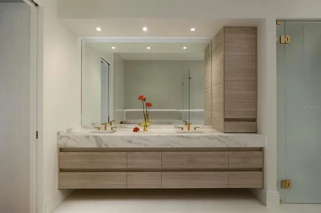 a bathroom with a double vanity sink and a mirror