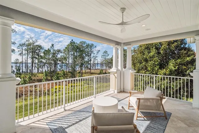 a view of a balcony with furniture