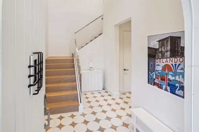 a view of entryway with stairs and wooden floor