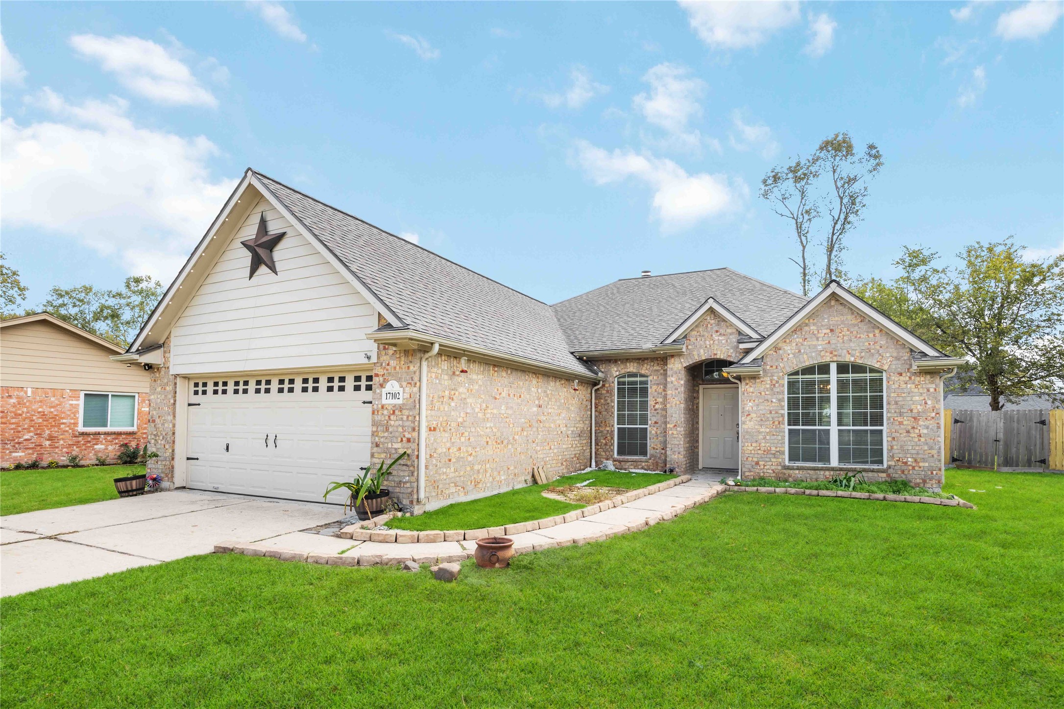 17102 Jetty Court Crosby, TX 77532 - Photo 2 of 39 Welcoming front path, large windows, well-maintained lawn, offering curb appeal in a suburban setting.