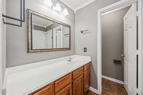 a bathroom with a sink a vanity and a mirror