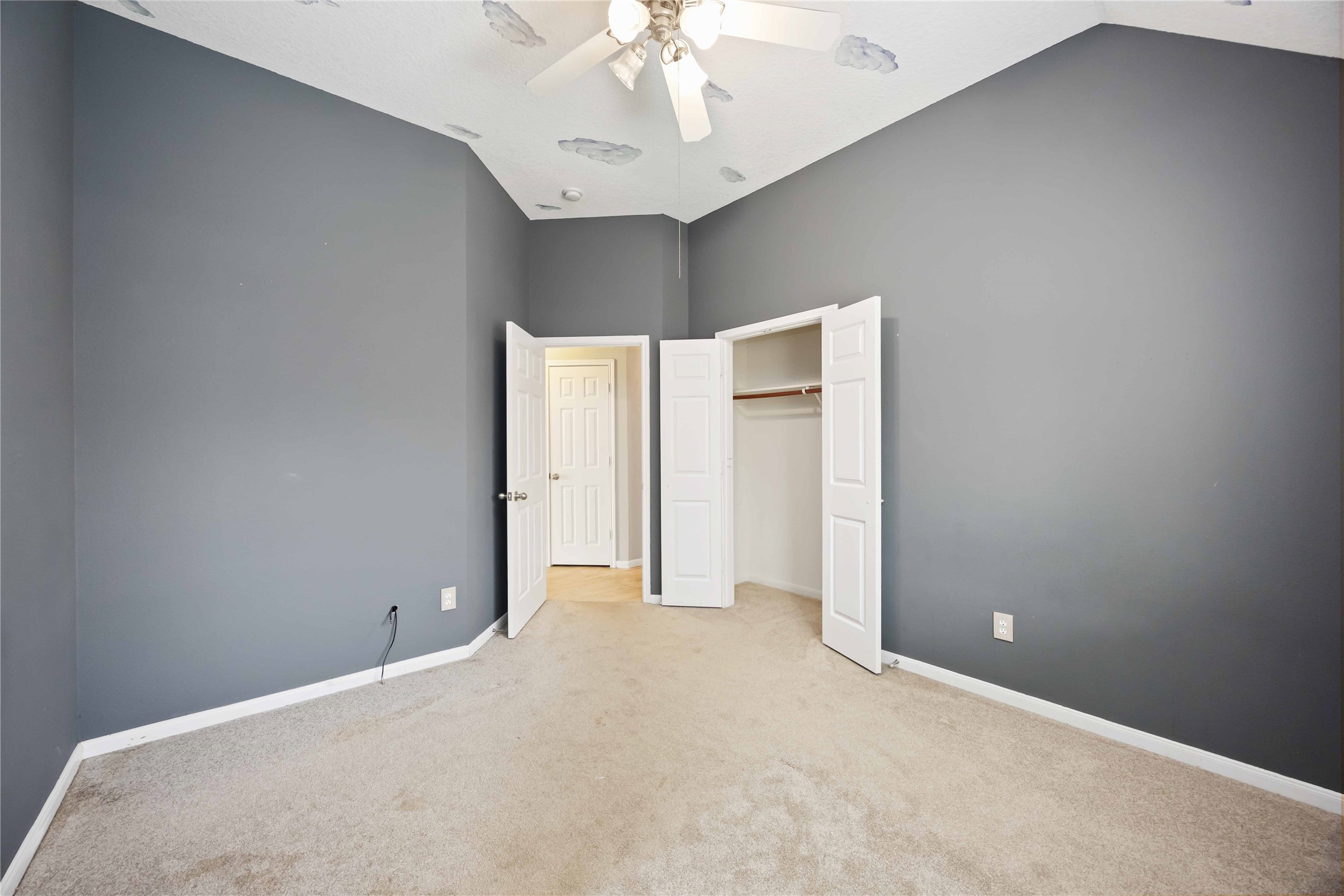 17102 Jetty Court Crosby, TX 77532 - Photo 31 of 39 3rd bedroom has a small closet with double doors and an adjacent entrance. The space is well-lit and versatile for various uses.