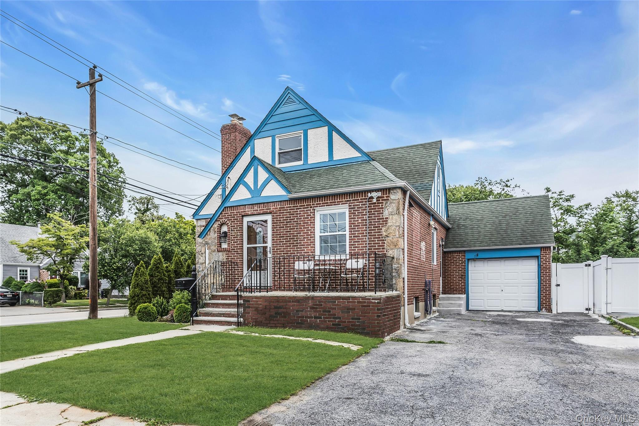 103 Union Street Valley Stream, NY 11580 - Photo 1 of 19 a front view of a house with a yard