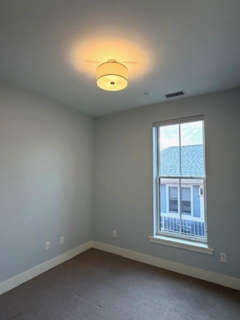 13 West Central Street, Unit 2 Natick, MA 01760 - Photo 9 of 14 an empty room with a window