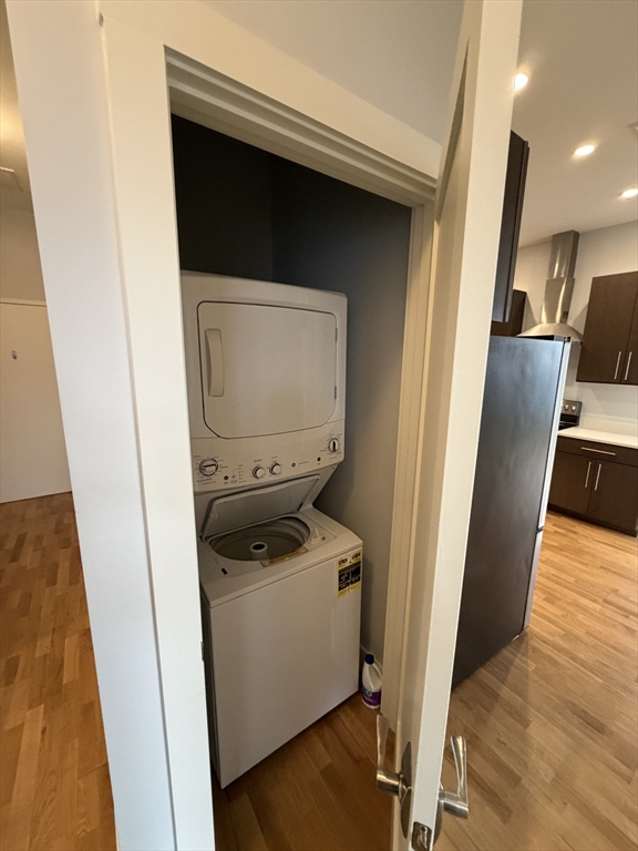 13 West Central Street, Unit 2 Natick, MA 01760 - Photo 10 of 14 a utility room with wooden floor washer and dryer