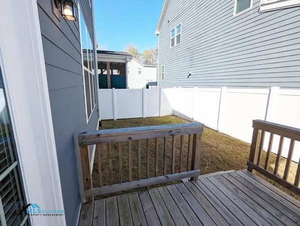 a view of a balcony with wooden floor