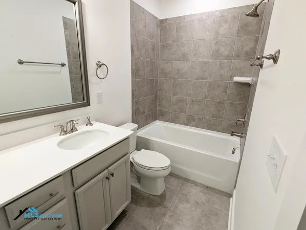a bathroom with a sink a toilet and a bathtub