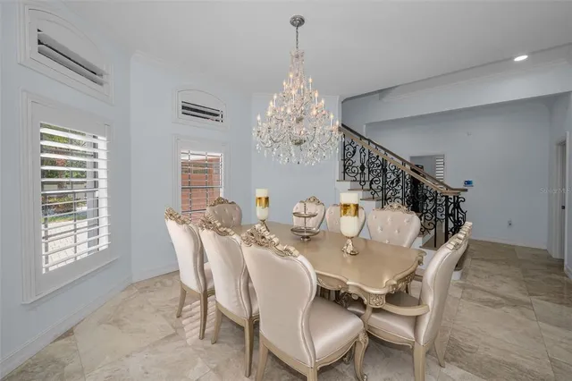 a living room with furniture fireplace and potted plant