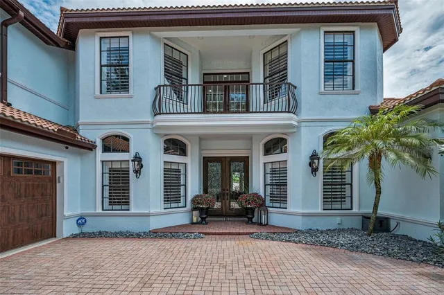 a living room filled with furniture and wooden floor