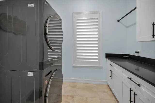an aerial view of a golf course with swimming pool and outdoor seating