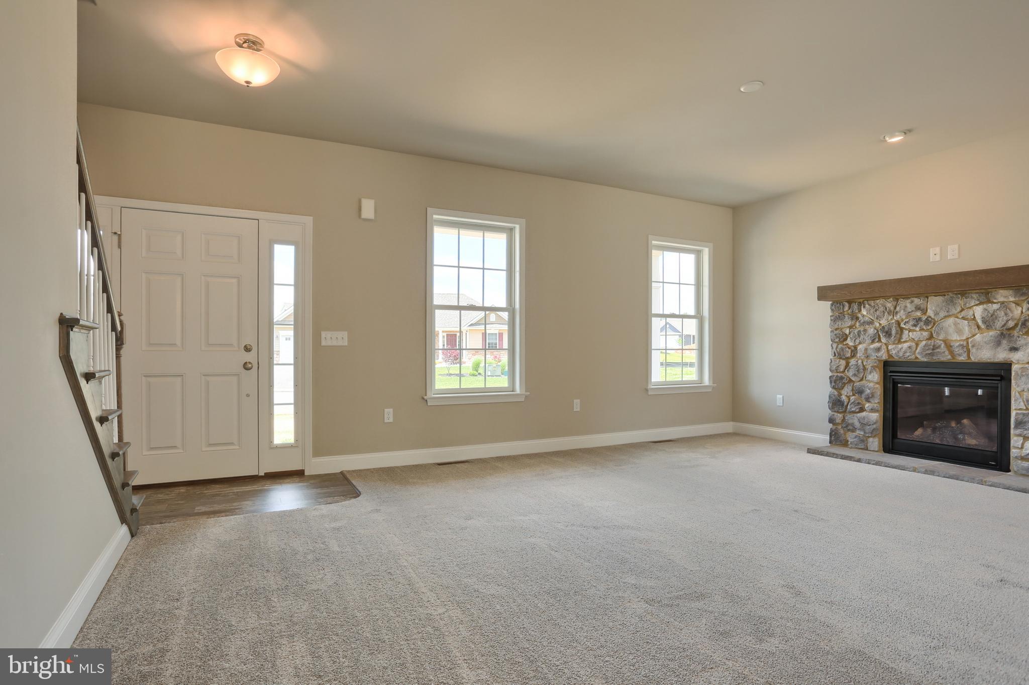 1 Rolling Meadow Road Lebanon, PA 17046 - Photo 3 of 21 an empty room with windows and fireplace
