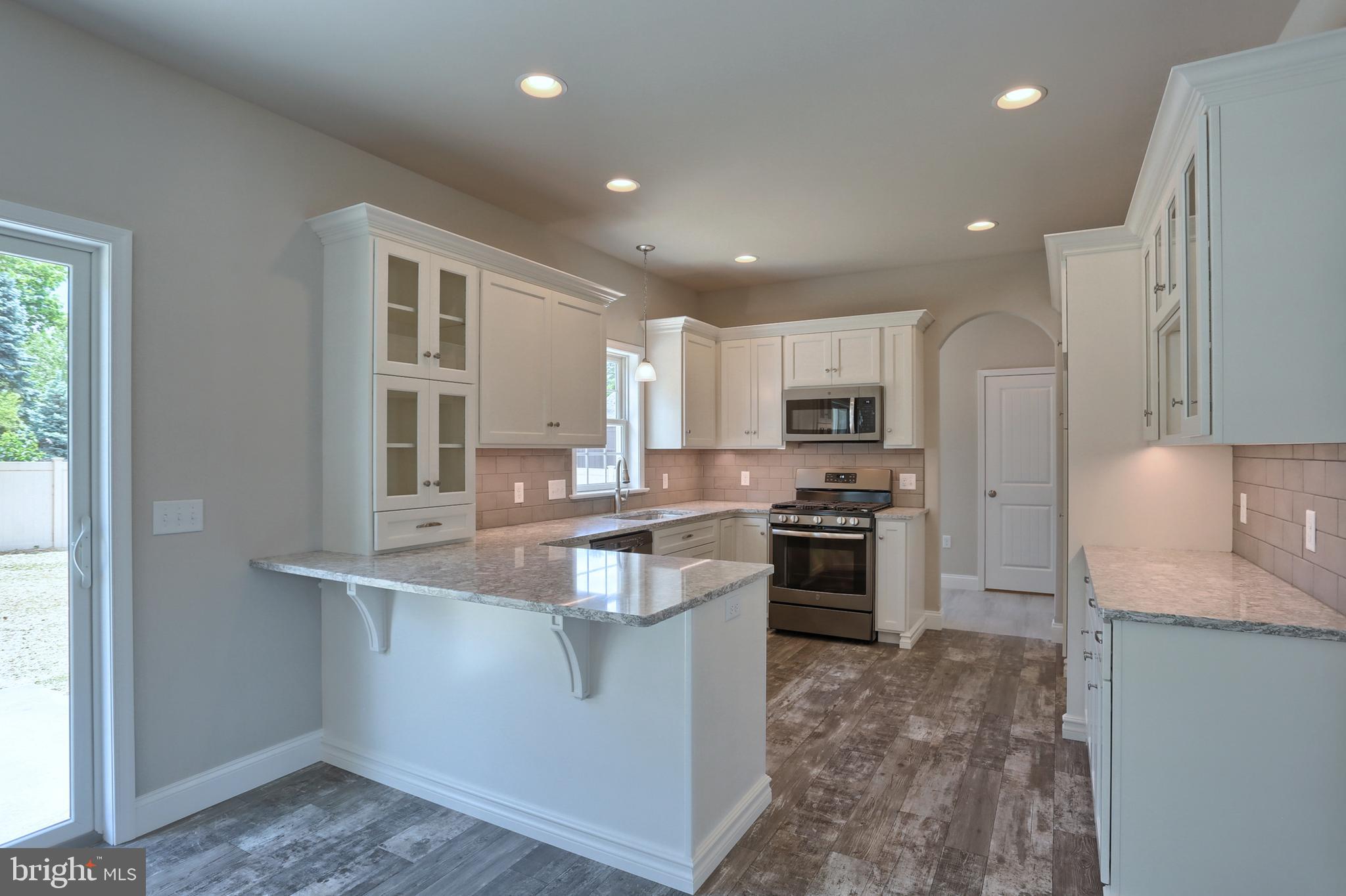 1 Rolling Meadow Road Lebanon, PA 17046 - Photo 9 of 21 a large kitchen with stainless steel appliances granite countertop a stove a sink and a refrigerator