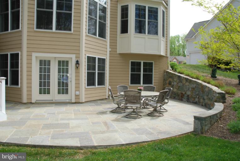 327 Reserve Gate Terrace Silver Spring, MD 20905 - Photo 20 of 28 Stone Patio with retaining wall
