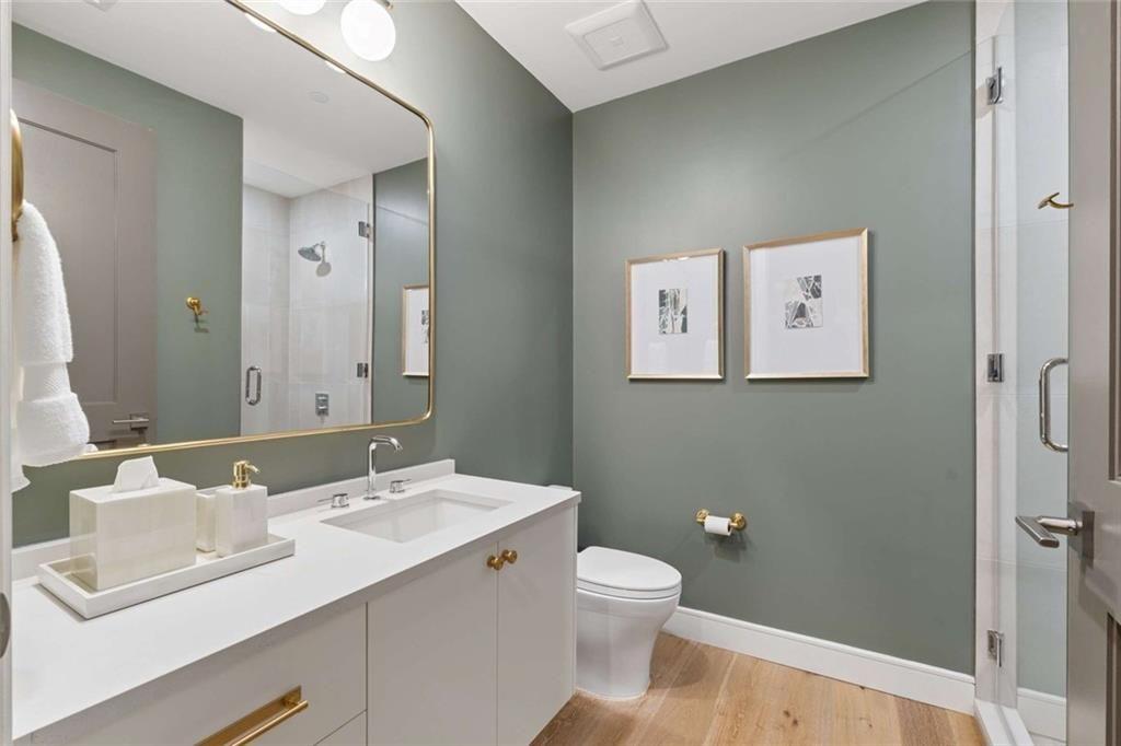 2520 Peachtree Road, Unit 603 Atlanta, GA 30305 - Photo 13 of 91 a bathroom with a sink mirror vanity and a toilet