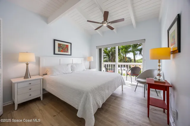 a view of a chair and table in the balcony