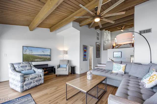 a view of a balcony with wooden floor