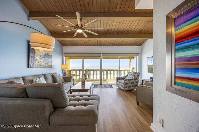 a view of a livingroom with furniture and front door