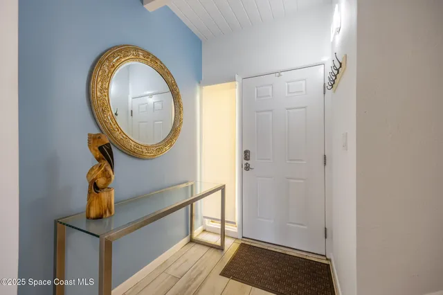 a view of a livingroom with furniture and wooden floor