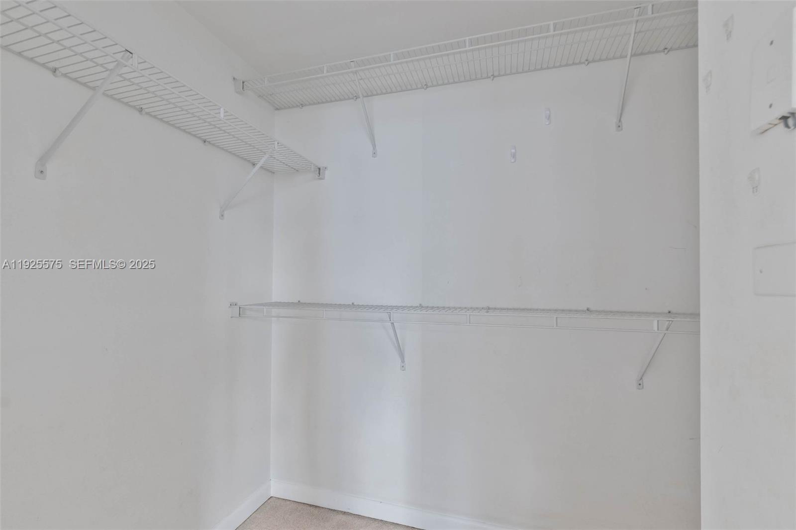 7355 Southwest 89th Street, Unit 502N Miami, FL 33156 - Photo 11 of 14 a view of a rack on the wall