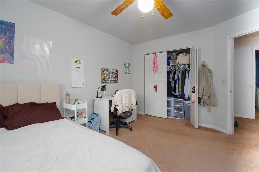 2300 Southwest 43rd Street, Unit K5 Gainesville, FL 32607 - Photo 4 of 18 a bedroom with furniture and a gym equipment