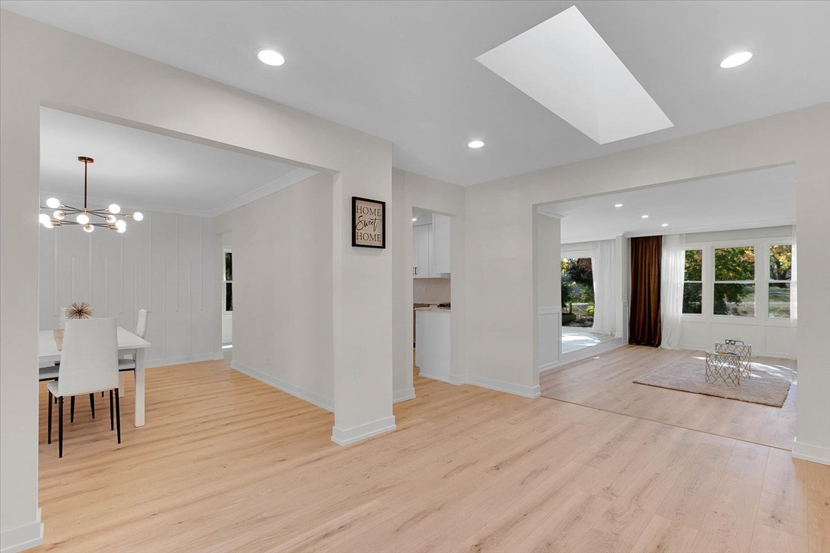 6705 Breckenridge Road Lisle, IL 60532 - Photo 12 of 41 a view of an empty room with wooden floor and a window