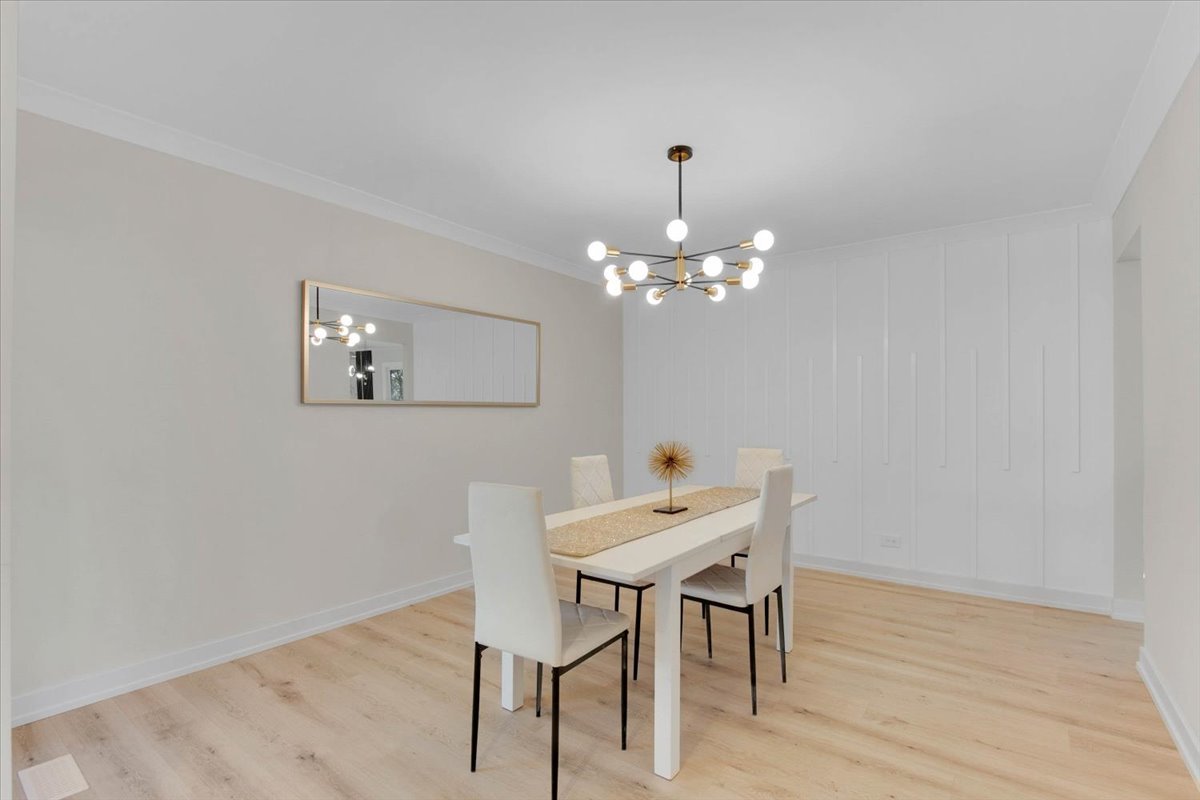 6705 Breckenridge Road Lisle, IL 60532 - Photo 14 of 41 a view of a dining room with furniture and chandelier