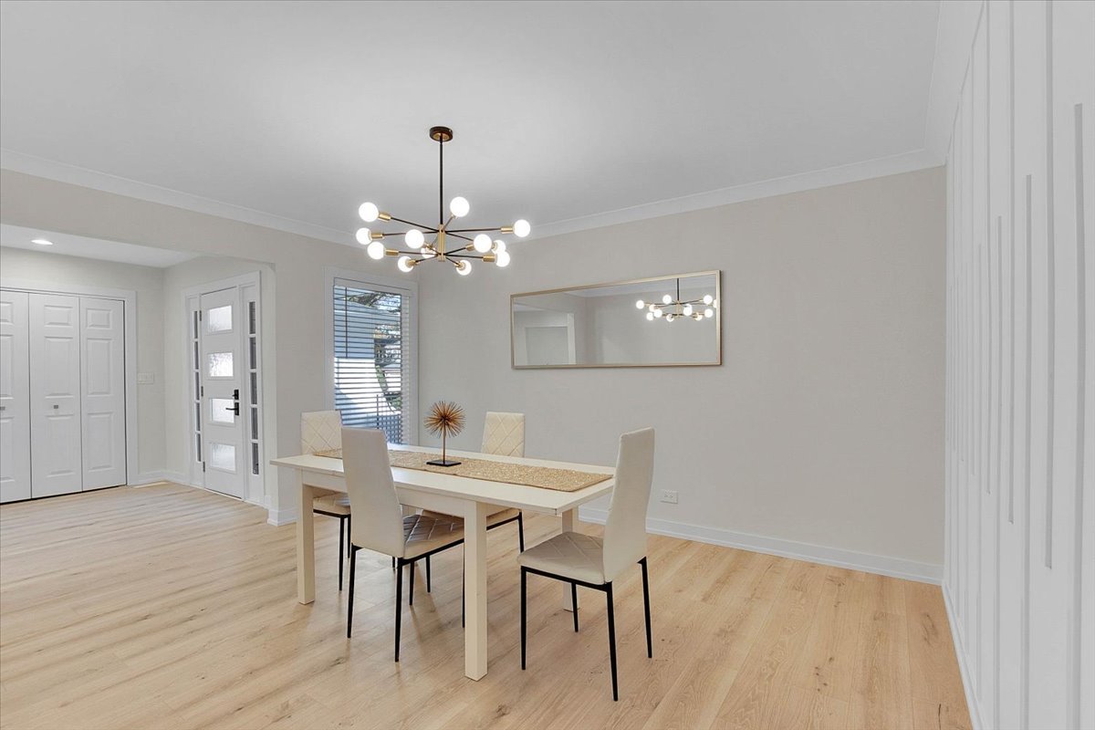 6705 Breckenridge Road Lisle, IL 60532 - Photo 15 of 41 a view of a dining room with furniture and wooden floor