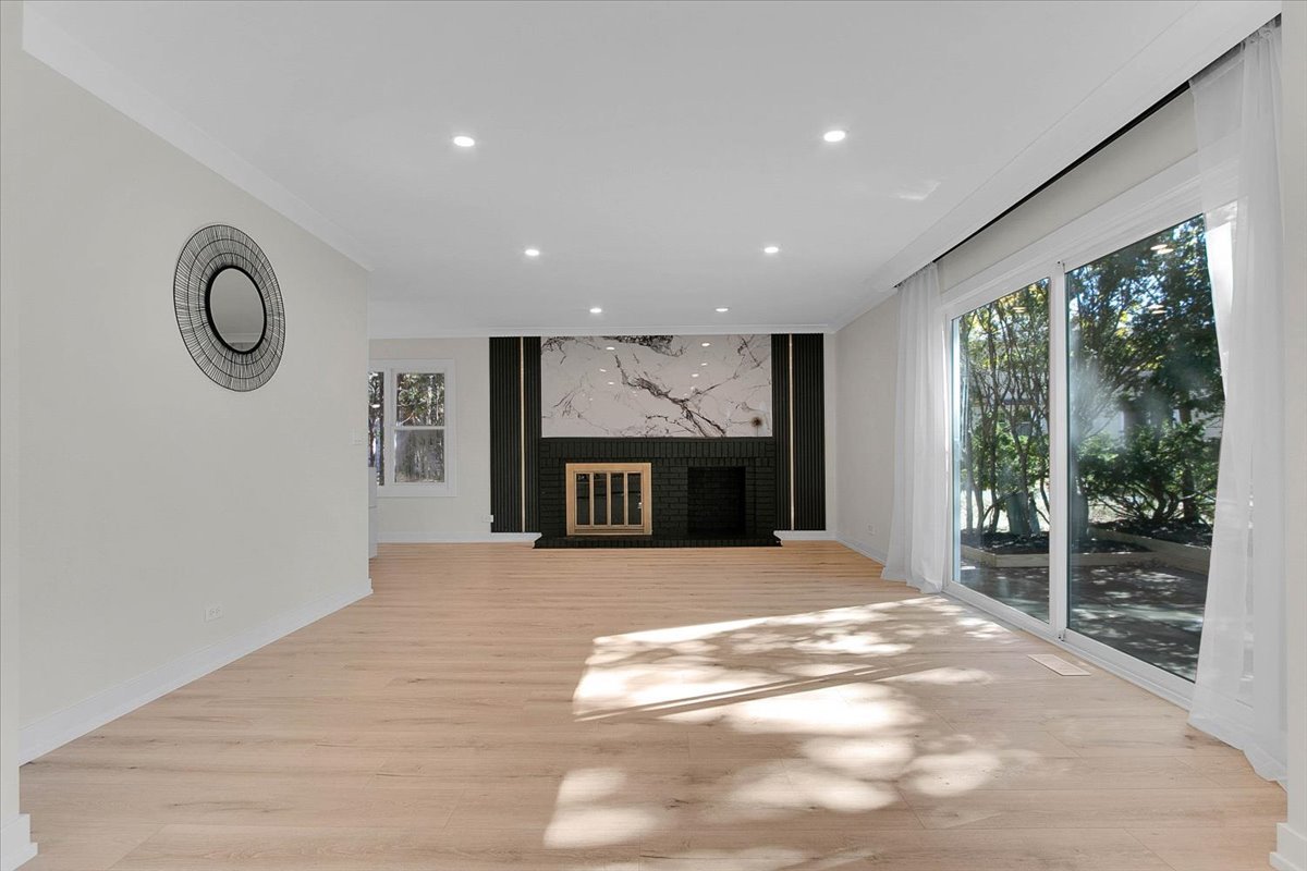 6705 Breckenridge Road Lisle, IL 60532 - Photo 23 of 41 a view of an empty room with a fireplace and a window
