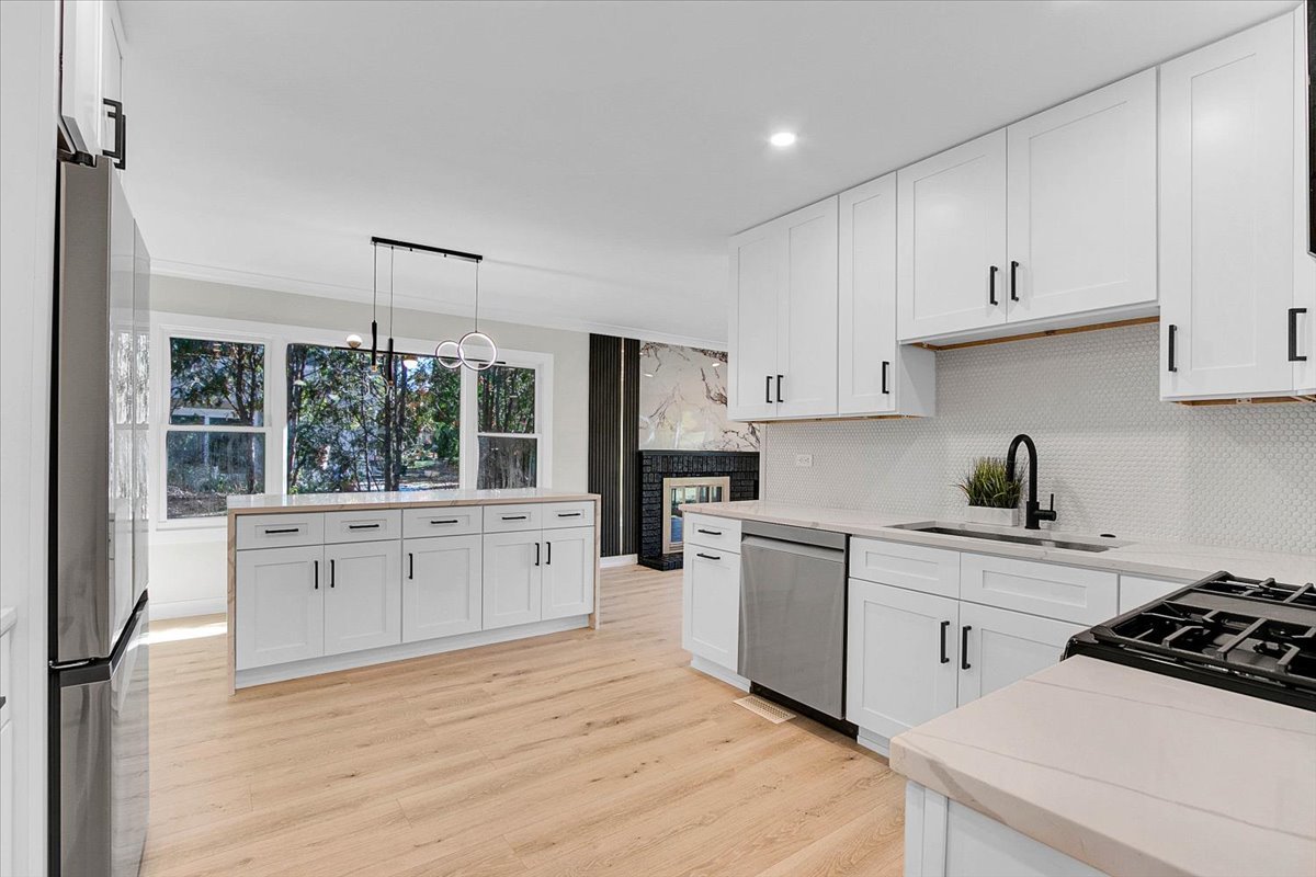 6705 Breckenridge Road Lisle, IL 60532 - Photo 28 of 41 a kitchen with white cabinets and white appliances