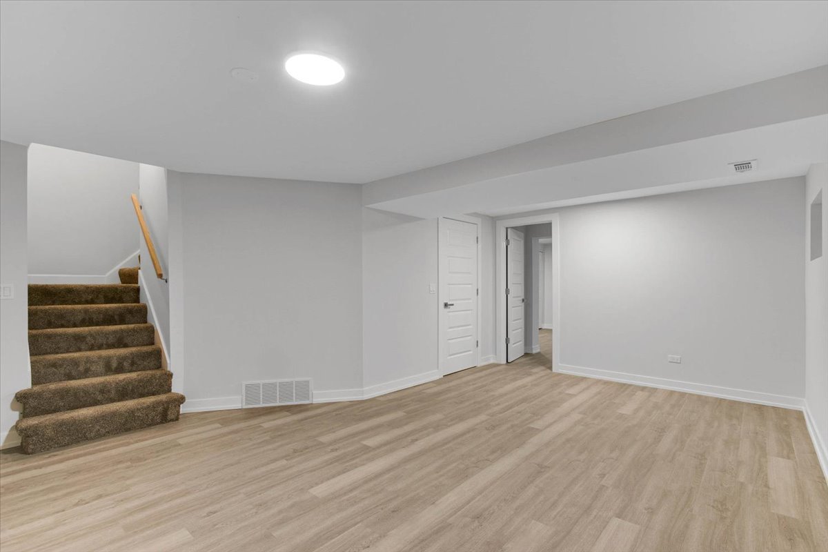 6705 Breckenridge Road Lisle, IL 60532 - Photo 32 of 41 a view of an empty room with stairs and ventilation